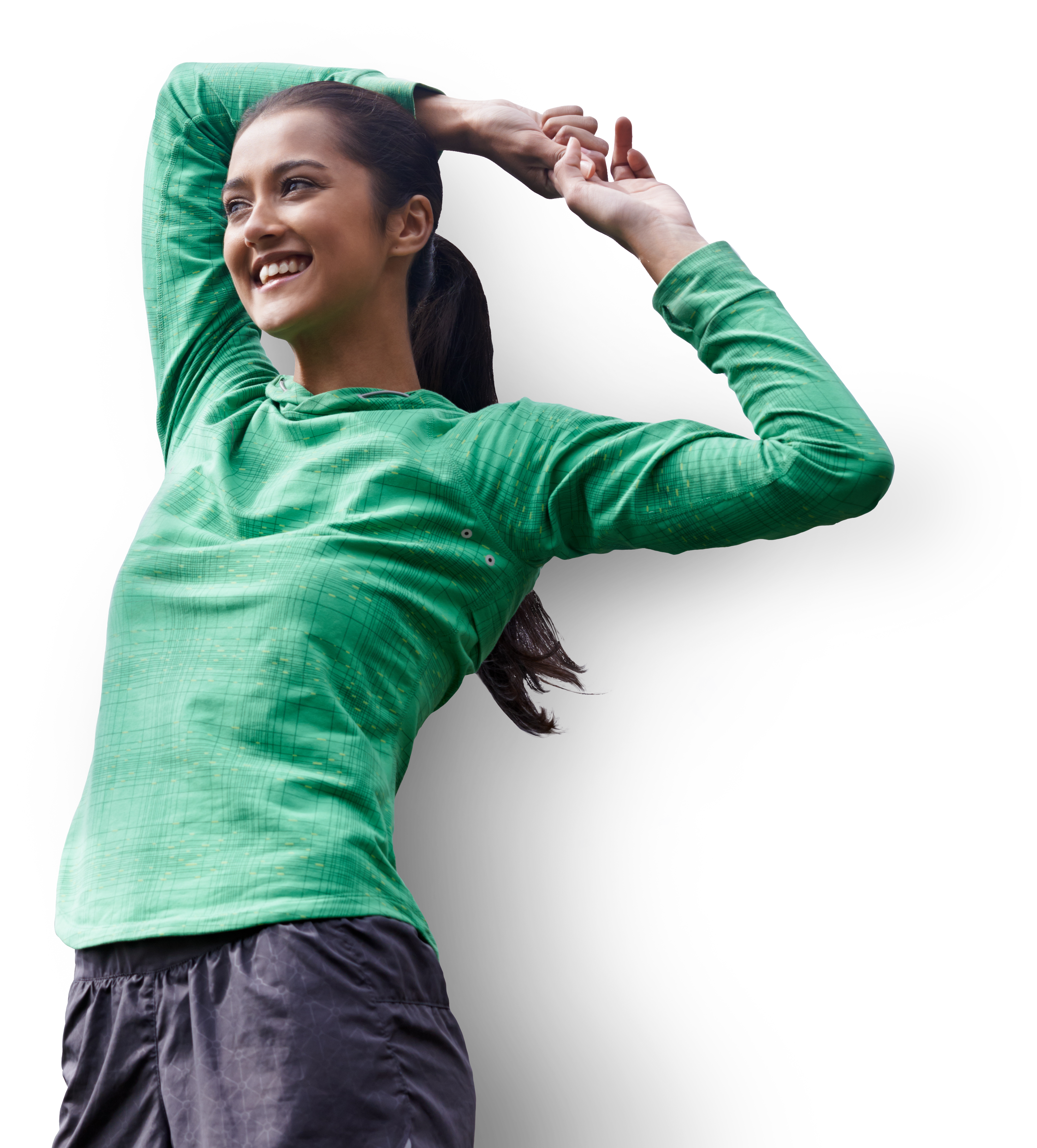Woman stretching and smiling in a green shirt