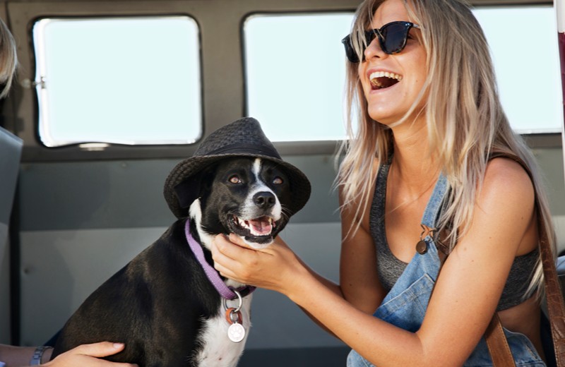 woman patting her dog